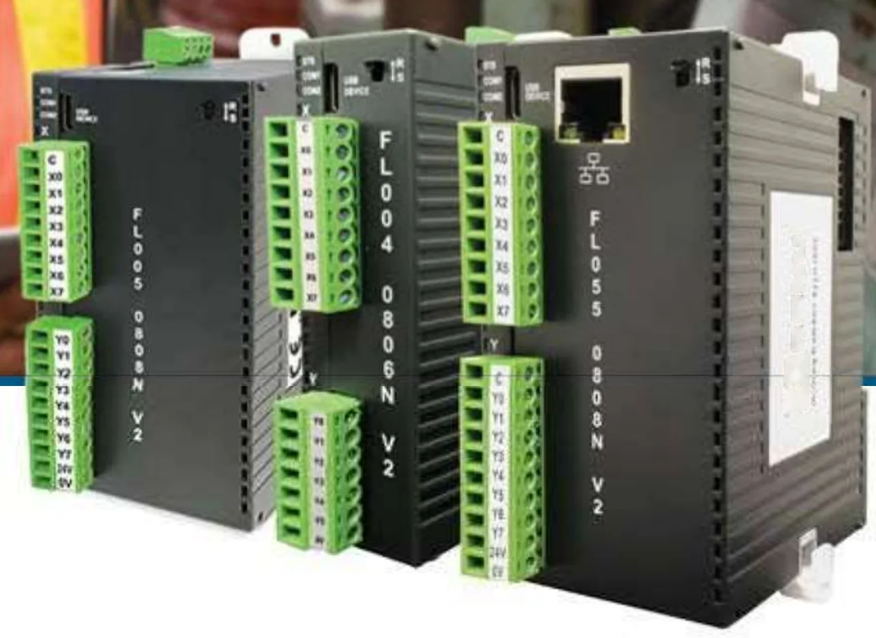 Eco and standard PLCs side by side; the expansion modules snap onto the same rail beside them